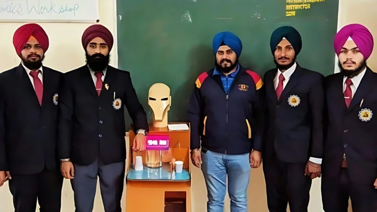 team standing along with the Aqua Serving Robot